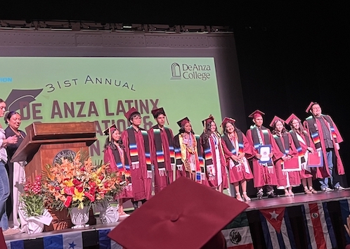 students on stage at Latinx Grad