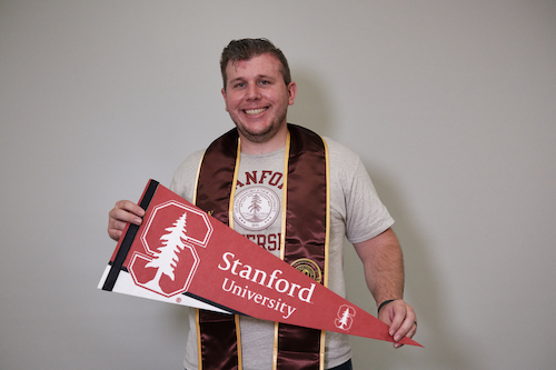 student with Stanford pennant