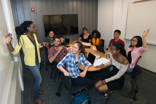 Students with an instructor at the board